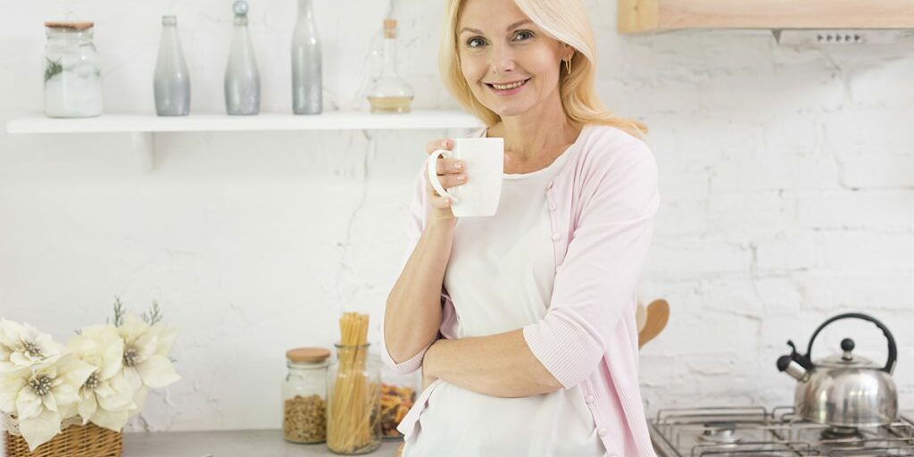 portrait-senior-woman-holding-cup-coffee