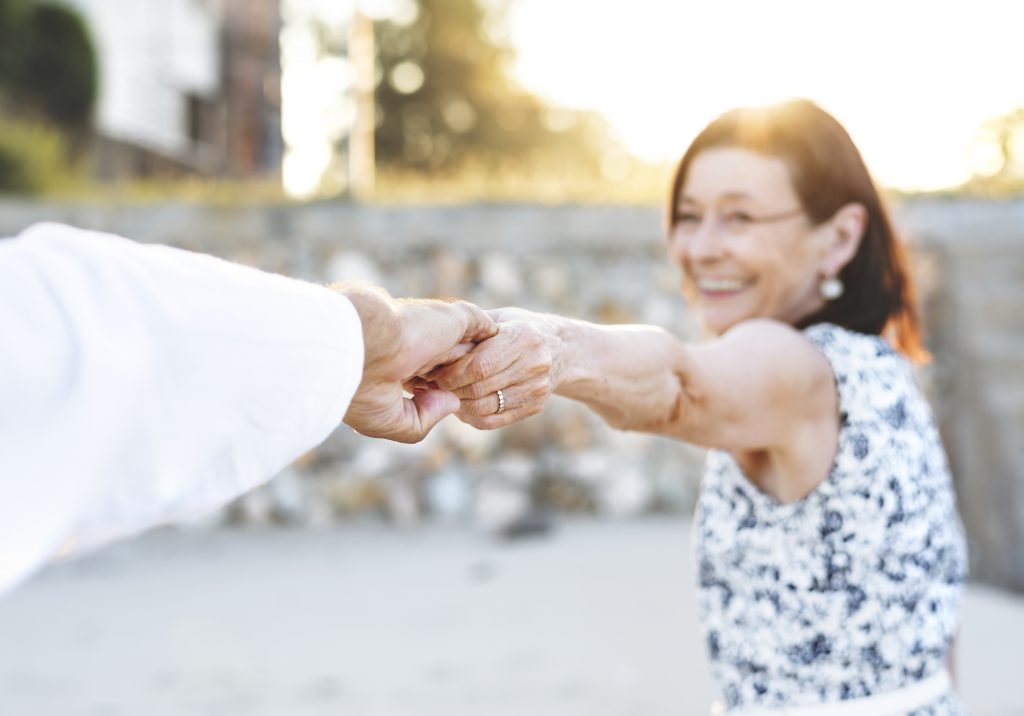 Senior couple holding hands 