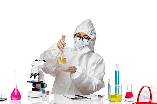 front view young female chemist in special protective suit holdi