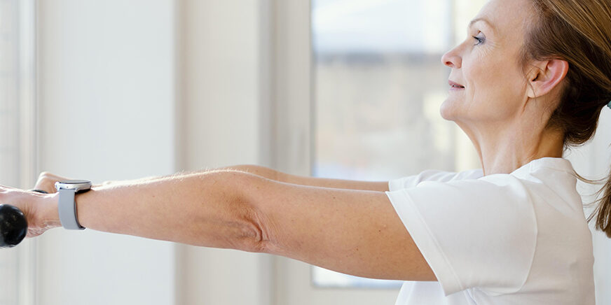 woman holding dumbbell