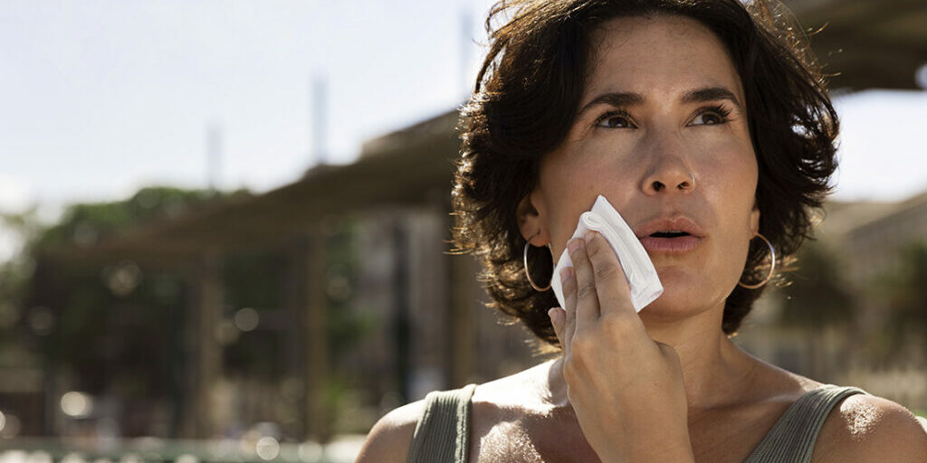 elder-woman-struggling-with-high-temperature