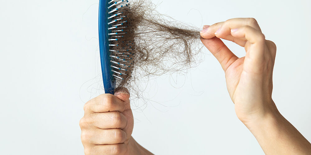 Hairbrush with a lot of female hair